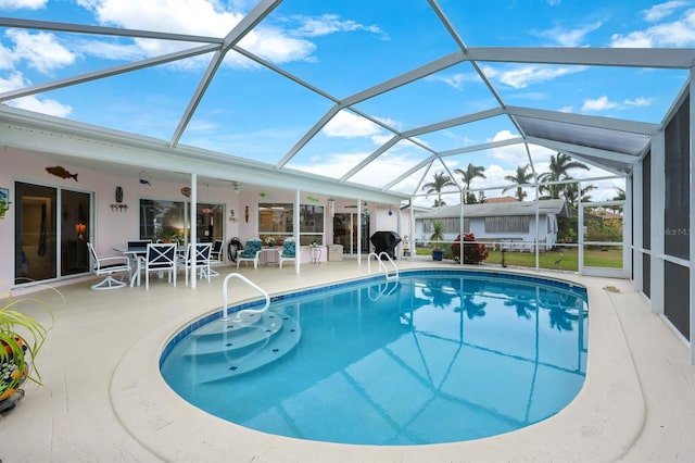 view of pool with a lanai and a patio area