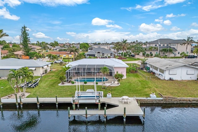 exterior space featuring a water view, a yard, and a lanai