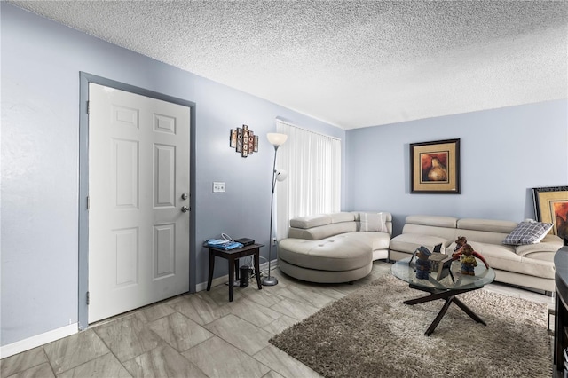 living room featuring a textured ceiling