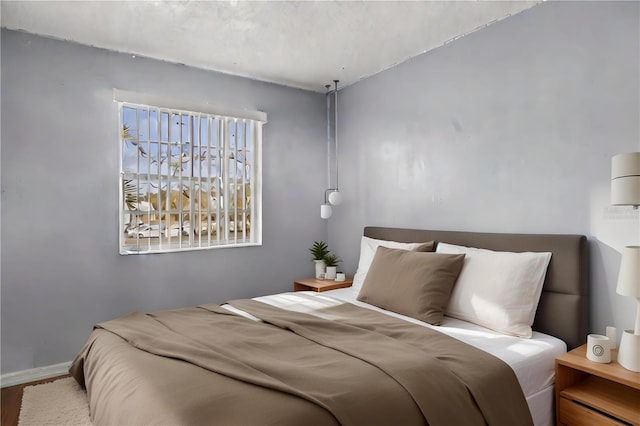 bedroom featuring wood-type flooring