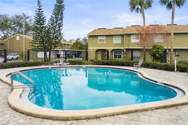 view of swimming pool with a patio area