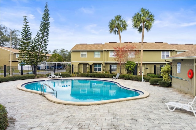 view of swimming pool featuring a patio area