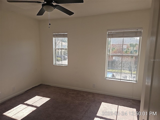 carpeted spare room with ceiling fan