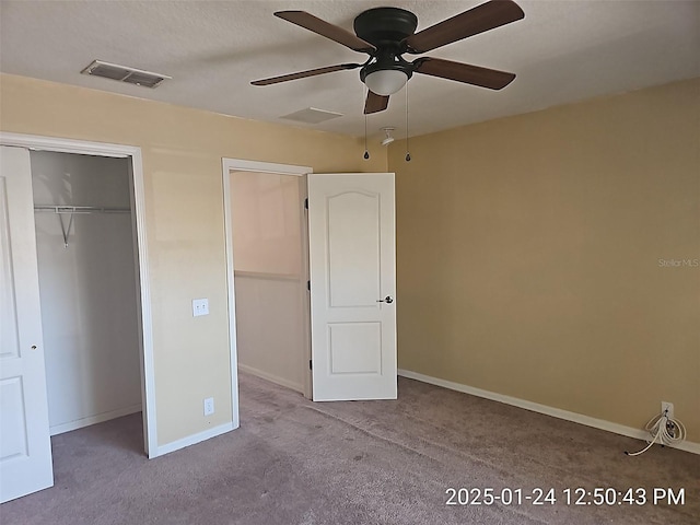 unfurnished bedroom with light colored carpet and ceiling fan