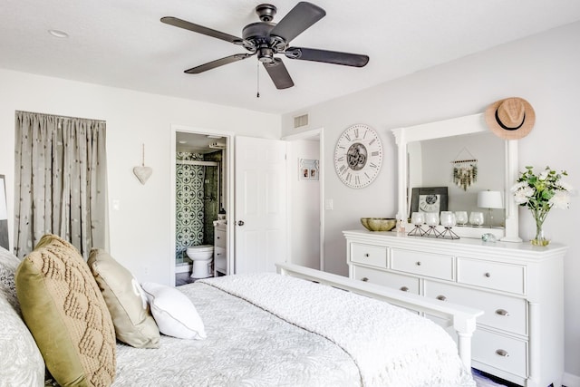 bedroom featuring ceiling fan and ensuite bath