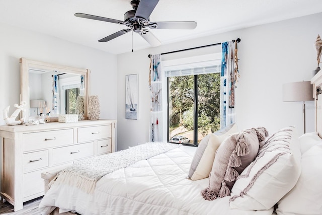 bedroom with light hardwood / wood-style floors and ceiling fan