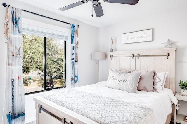 bedroom featuring multiple windows and ceiling fan