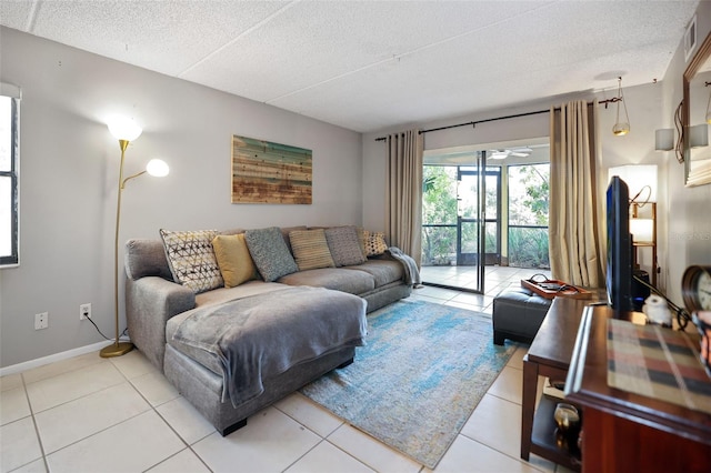 living room featuring light tile patterned floors and a textured ceiling