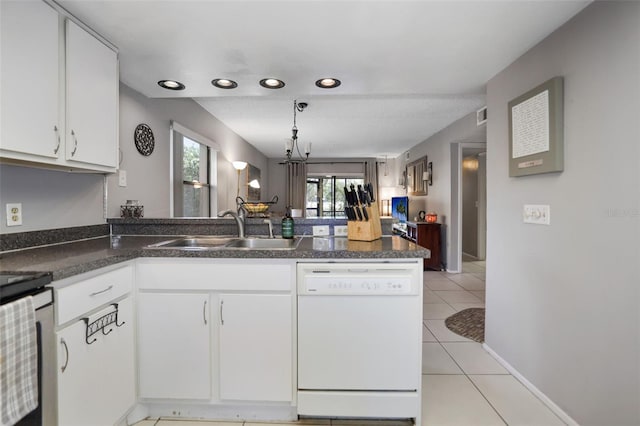 kitchen featuring sink, white cabinets, and dishwasher