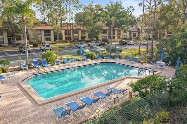 view of swimming pool with a patio