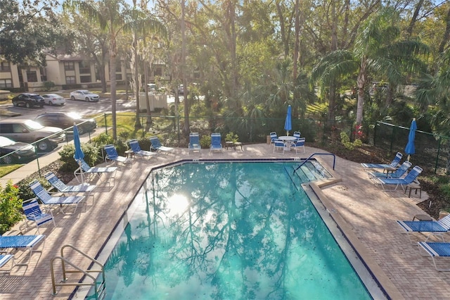 view of swimming pool with a patio