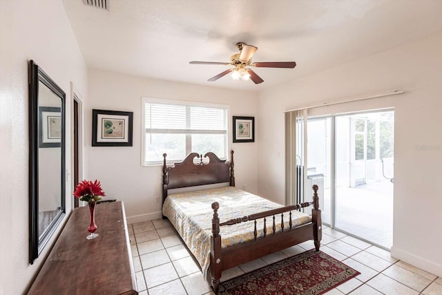 bedroom with multiple windows, access to exterior, and light tile patterned floors