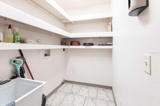 washroom featuring sink and hookup for a washing machine