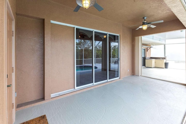 view of patio featuring ceiling fan