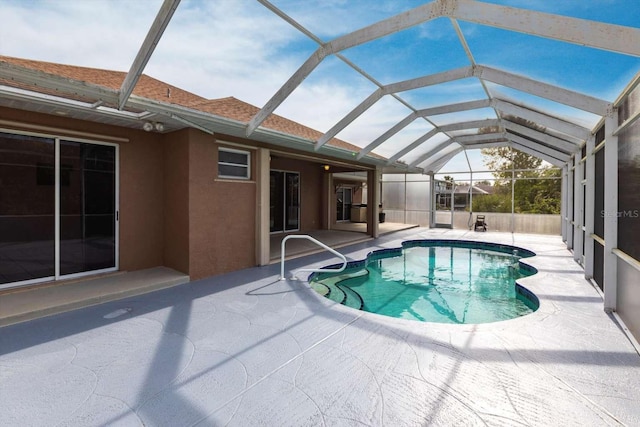 view of pool with a lanai and a patio area