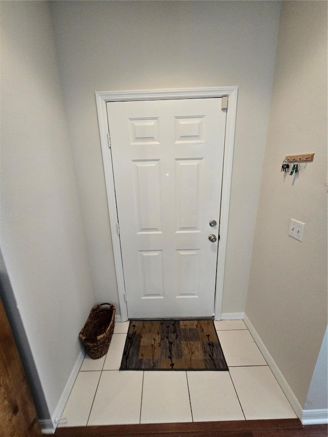 entryway with light tile patterned floors