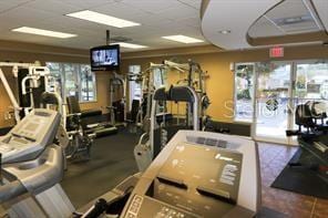 workout area featuring a drop ceiling