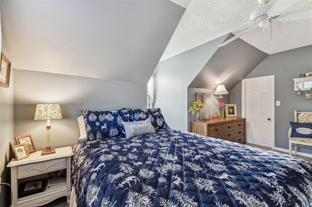 bedroom with ceiling fan, vaulted ceiling, and a textured ceiling