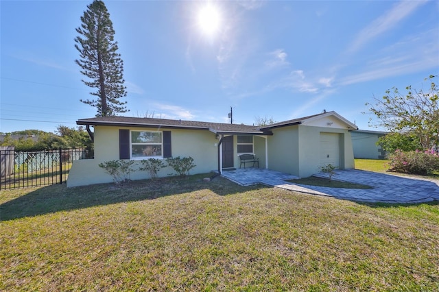 single story home with a garage and a front yard