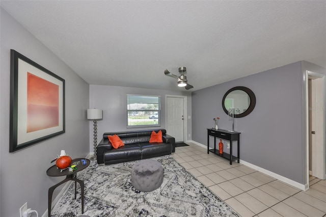 tiled living room with a textured ceiling