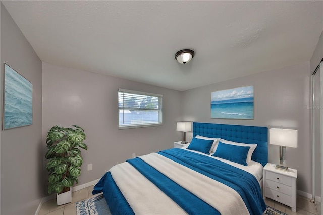 bedroom with light tile patterned flooring