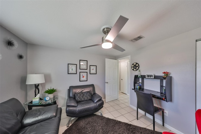 tiled living room featuring ceiling fan