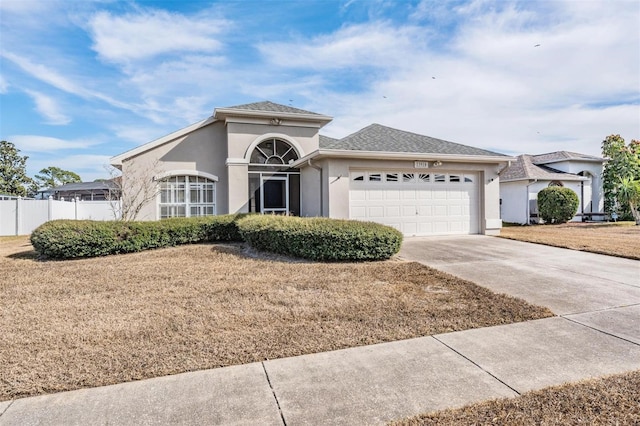 view of front of property with a garage