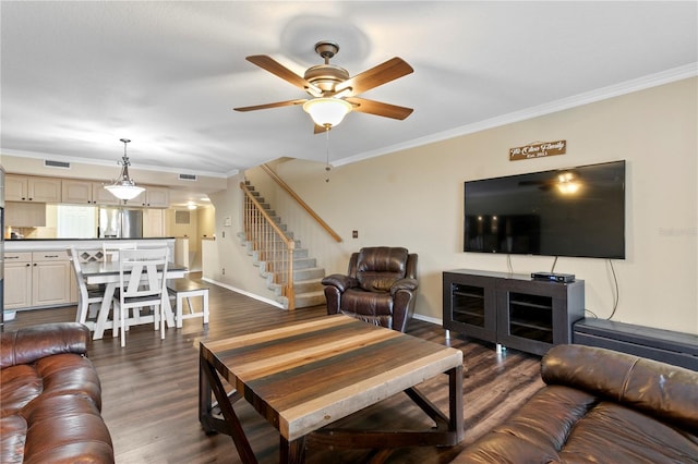 living room with ceiling fan, ornamental molding, and dark hardwood / wood-style flooring