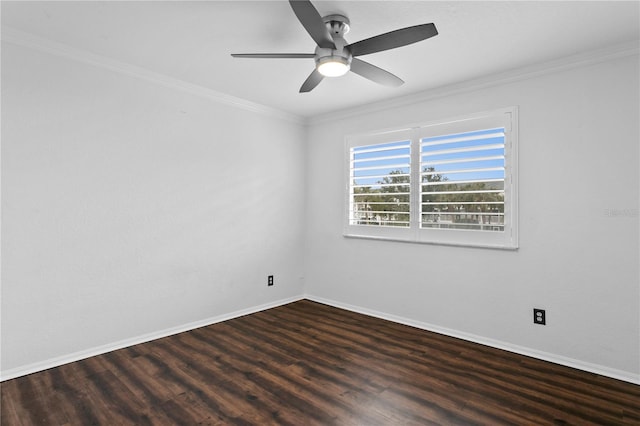 empty room featuring crown molding, ceiling fan, and dark wood-type flooring