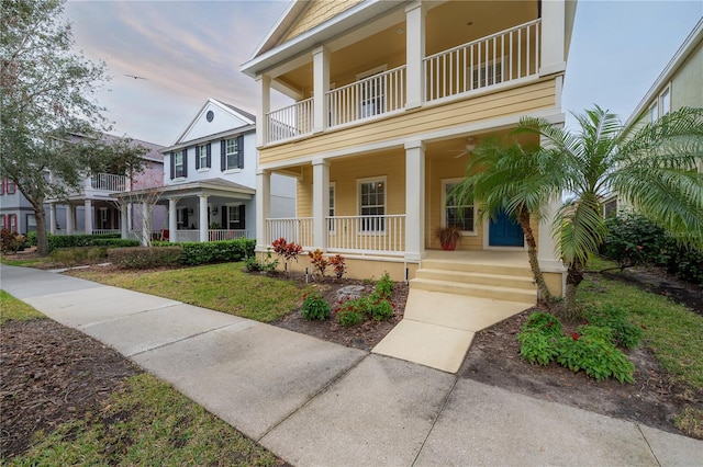 view of front of house featuring a balcony