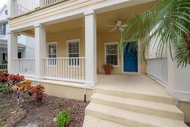 doorway to property with covered porch and ceiling fan