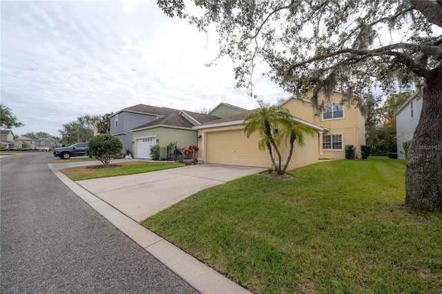 view of front of property with a garage and a front yard