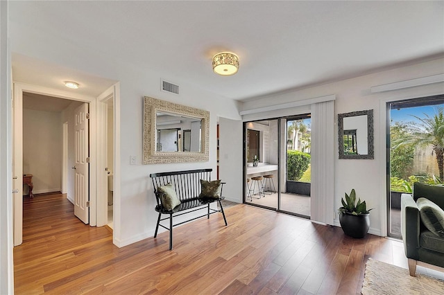 doorway to outside with wood-type flooring