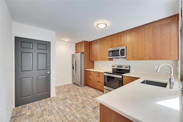 kitchen with appliances with stainless steel finishes and sink