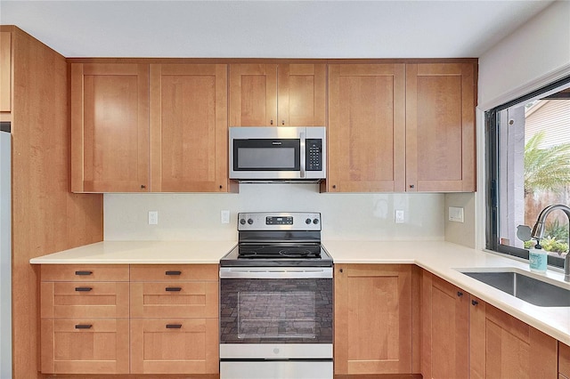 kitchen featuring appliances with stainless steel finishes and sink