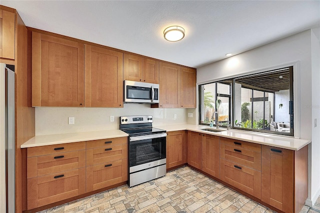 kitchen with stainless steel appliances and sink