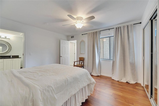 bedroom featuring ceiling fan and hardwood / wood-style floors