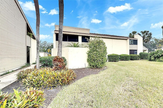 exterior space featuring a front yard