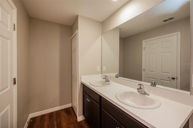 bathroom with vanity and hardwood / wood-style floors