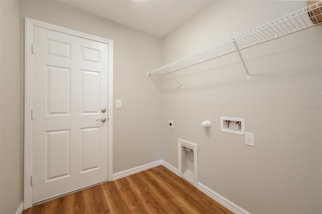 laundry area featuring hookup for a washing machine, gas dryer hookup, hardwood / wood-style flooring, and hookup for an electric dryer