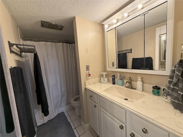 full bathroom featuring visible vents, toilet, tile patterned flooring, a textured ceiling, and vanity