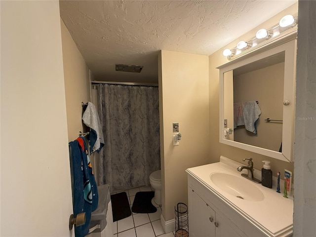 bathroom with a shower with curtain, toilet, a textured ceiling, vanity, and tile patterned flooring