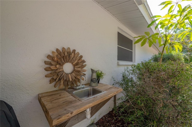 view of property exterior featuring sink