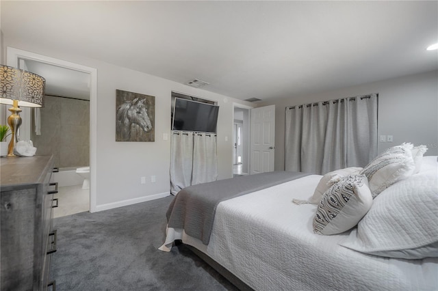 bedroom with connected bathroom, a closet, and dark colored carpet