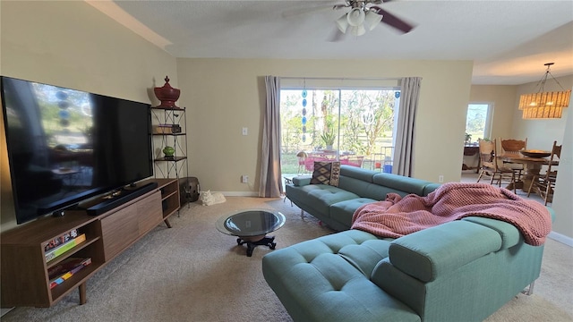 living room with light colored carpet and ceiling fan