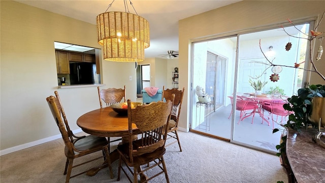 dining room with light colored carpet