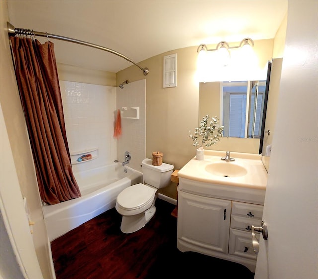 full bathroom with hardwood / wood-style flooring, vanity, toilet, and shower / bath combo with shower curtain