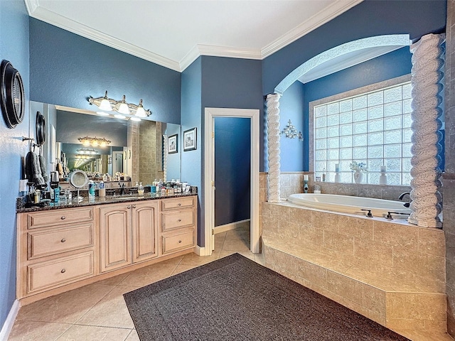 bathroom featuring vanity, crown molding, tile patterned floors, and tiled bath