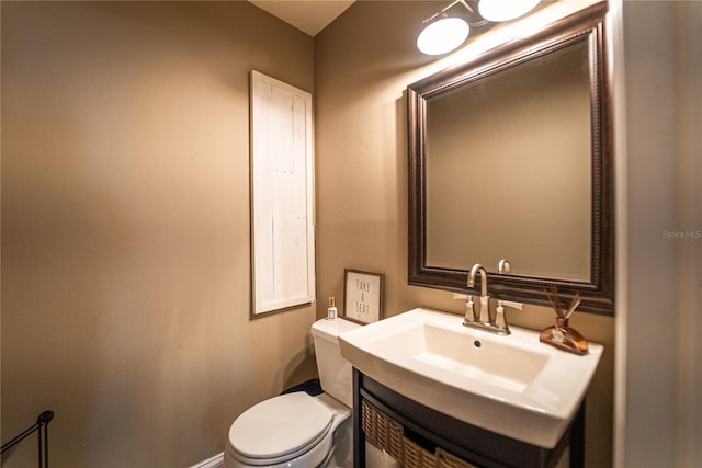 bathroom featuring a sink and toilet