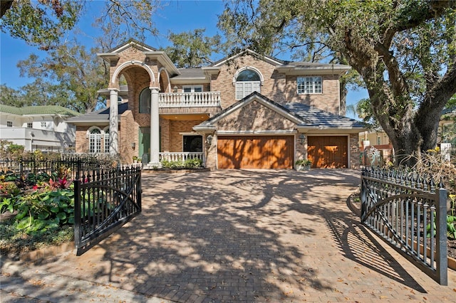 view of front facade with a garage and a balcony